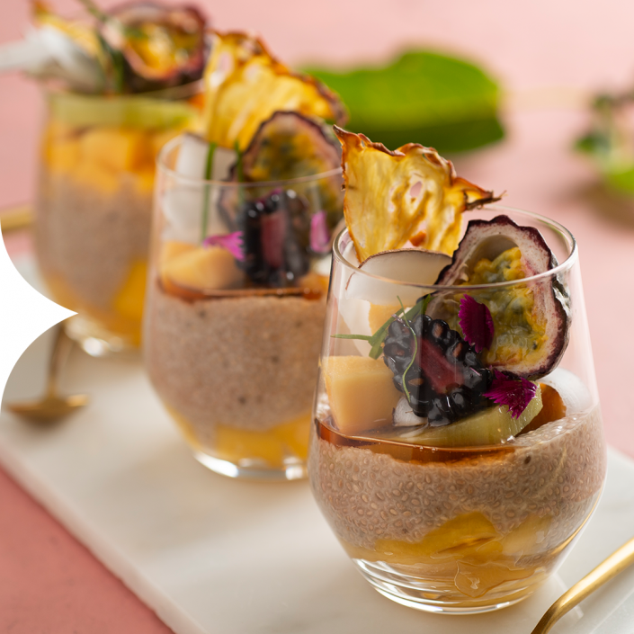 Tropical fruit with coconut almond milk chia pudding with ginger wine syrup